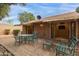 Paver patio featuring outdoor seating, covered area, and view into the interior at 54 Leisure World --, Mesa, AZ 85206