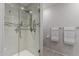 Bathroom featuring a glass shower with decorative tiling and updated fixtures at 54 Leisure World --, Mesa, AZ 85206