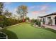 Well-manicured backyard with a putting green and cacti at 6640 E Kasba Cir, Paradise Valley, AZ 85253