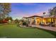 Expansive backyard with putting green, desert landscaping, and a fire pit at 6640 E Kasba Cir, Paradise Valley, AZ 85253
