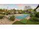 Recreational backyard featuring a sports court, putting green, and desert landscaping at 6640 E Kasba Cir, Paradise Valley, AZ 85253