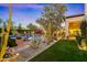 Lush backyard with a stunning pool, desert landscaping, and artificial turf at 6640 E Kasba Cir, Paradise Valley, AZ 85253