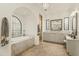 Elegant bathroom showcases a soaking tub, shower, and vanity with classic fixtures and finishes at 6640 E Kasba Cir, Paradise Valley, AZ 85253