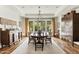 Elegant dining room with ample natural light, a large dining table, and beautiful hardwood floors at 6640 E Kasba Cir, Paradise Valley, AZ 85253