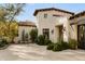 Beautiful home featuring mature desert landscaping, stone walkways and a charming covered patio at 6640 E Kasba Cir, Paradise Valley, AZ 85253
