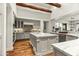 Bright kitchen with white cabinetry, marble countertops, stainless steel appliances, and a spacious island at 6640 E Kasba Cir, Paradise Valley, AZ 85253