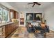 Cozy kitchenette with custom cabinetry, stone tile floor, and a sitting area at 6640 E Kasba Cir, Paradise Valley, AZ 85253