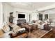 Cozy living room featuring plush sofas, decorative rug, fireplace, and a media center at 6640 E Kasba Cir, Paradise Valley, AZ 85253