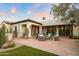 Inviting outdoor patio area with comfortable seating, outdoor kitchen, and lush landscaping at 6640 E Kasba Cir, Paradise Valley, AZ 85253