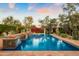 Sparkling swimming pool surrounded by mature trees and privacy hedges at 6640 E Kasba Cir, Paradise Valley, AZ 85253