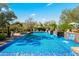 Stunning pool with water features, surrounded by lush landscaping, and lounge chairs at 6640 E Kasba Cir, Paradise Valley, AZ 85253