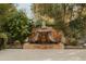 Tranquil outdoor water feature surrounded by lush greenery, creating a peaceful and serene atmosphere at 6640 E Kasba Cir, Paradise Valley, AZ 85253