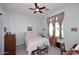 A well-lit bedroom featuring a bed, dresser, and a ceiling fan for comfort, bathed in natural light at 6730 E Hermosa Vista Dr # 20, Mesa, AZ 85215