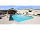 Relaxing community pool and patio area with ample seating for residents to enjoy sunny days at 6730 E Hermosa Vista Dr # 20, Mesa, AZ 85215