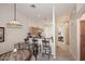 Cozy dining area featuring a breakfast bar that connects to the adjacent kitchen at 6730 E Hermosa Vista Dr # 20, Mesa, AZ 85215
