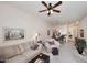 Comfortable living room showcasing an open floor plan with views into the dining area and kitchen at 6730 E Hermosa Vista Dr # 20, Mesa, AZ 85215