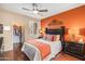 Comfortable bedroom with hardwood floors, ceiling fan, and a spacious walk-in closet at 7009 E Acoma Dr # 1113, Scottsdale, AZ 85254