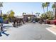 Gated entrance to The Plaza Residences with palm trees at 7009 E Acoma Dr # 1113, Scottsdale, AZ 85254