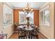 Cozy dining area with a stylish chandelier, natural light and decorative accents at 7009 E Acoma Dr # 1113, Scottsdale, AZ 85254
