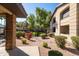 Exterior view of a condo with manicured landscaping, rock features, and proximity to community amenities at 7009 E Acoma Dr # 1113, Scottsdale, AZ 85254