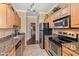 Well-appointed kitchen with stainless steel appliances, granite counters, and ample cabinet space at 7009 E Acoma Dr # 1113, Scottsdale, AZ 85254