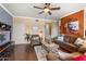 Bright living room featuring hardwood floors, neutral paint, and a cozy seating arrangement at 7009 E Acoma Dr # 1113, Scottsdale, AZ 85254