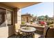 Cozy covered patio with patio furniture overlooking community pool at 7009 E Acoma Dr # 1113, Scottsdale, AZ 85254