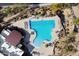 An aerial view of the community pool with chairs and desert landscaping at 7370 E Sunset Sky Cir, Scottsdale, AZ 85266