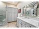 Luxurious bathroom features marble countertops, soft-close cabinets, a walk-in shower with glass door, and ample storage at 7370 E Sunset Sky Cir, Scottsdale, AZ 85266