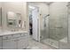 Spa-like bathroom features marble countertop vanity, walk-in shower with glass door, and walk-in closet access at 7370 E Sunset Sky Cir, Scottsdale, AZ 85266