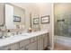 Elegant bathroom with dual sinks, marble countertops, and modern fixtures, including a glass-enclosed shower at 7370 E Sunset Sky Cir, Scottsdale, AZ 85266