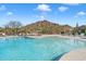 Resort-style swimming pool with ample seating and mountain views at 7370 E Sunset Sky Cir, Scottsdale, AZ 85266