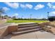 An exterior view of a stepped patio leading up to a well maintained grassy area at 7370 E Sunset Sky Cir, Scottsdale, AZ 85266
