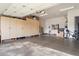 Spacious garage with epoxy flooring, ample storage cabinets, and plenty of room for parking and hobbies at 7370 E Sunset Sky Cir, Scottsdale, AZ 85266