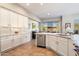 Bright kitchen featuring stainless steel appliances, stone countertops, ample counter space, and large sliding window at 7370 E Sunset Sky Cir, Scottsdale, AZ 85266