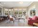 Bright living room featuring large windows with desert views, tile flooring, and comfortable seating at 7370 E Sunset Sky Cir, Scottsdale, AZ 85266