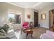 Cozy living room with ample natural light, comfortable seating, and views of the desert landscape at 7370 E Sunset Sky Cir, Scottsdale, AZ 85266
