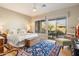 Comfortable bedroom with a king-size bed, wood floors, ceiling fan, and access to a private outdoor patio at 7370 E Sunset Sky Cir, Scottsdale, AZ 85266