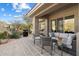 Inviting outdoor patio with comfortable seating, a built-in grill, and views of the desert landscape at 7370 E Sunset Sky Cir, Scottsdale, AZ 85266