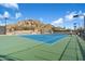 Well-maintained tennis court with a green and blue surface and desert views at 7370 E Sunset Sky Cir, Scottsdale, AZ 85266
