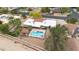 Stunning aerial view of a home with a sparkling pool and lush landscaping at 7820 S Maple Ave, Tempe, AZ 85284