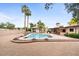 Spacious backyard with a pool, cabana, outdoor seating, and desert landscaping for relaxation and entertainment at 7820 S Maple Ave, Tempe, AZ 85284