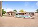Expansive backyard featuring a pool, covered patio, cabana, and desert landscaping, perfect for outdoor living at 7820 S Maple Ave, Tempe, AZ 85284