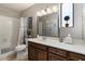 Bathroom with a shower/tub combo, vanity with drawers, and decorative elements at 7820 S Maple Ave, Tempe, AZ 85284