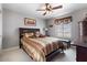 Cozy bedroom with striped bedding, and natural light from the window with custom valance at 7820 S Maple Ave, Tempe, AZ 85284