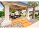 Outdoor cabana featuring comfortable seating, ceiling fan, and stylish decor for relaxation and entertainment at 7820 S Maple Ave, Tempe, AZ 85284
