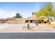 Charming single-story home featuring desert landscaping, and a three-car garage at 7820 S Maple Ave, Tempe, AZ 85284