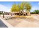 Inviting single-story home featuring desert landscaping and mature tree at 7820 S Maple Ave, Tempe, AZ 85284