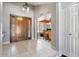 Welcoming foyer with tile flooring, closet, and a decorative wood front door at 7820 S Maple Ave, Tempe, AZ 85284
