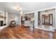 Spacious open-concept living room with hard wood floors and a fireplace at 7820 S Maple Ave, Tempe, AZ 85284